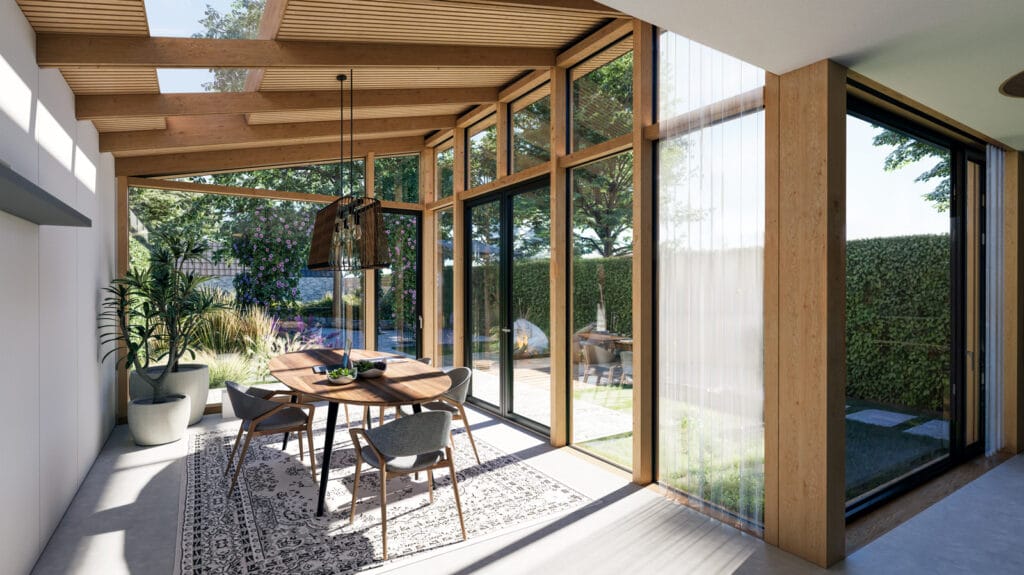Tuinkamer met zacht licht door grote boom. Repetitie van houten spanten in constructie en gekleurde akoestische achterwand. Lessenaarskap voor zicht op walnootboomkroon. Centrale eettafel: dineren in de tuin.