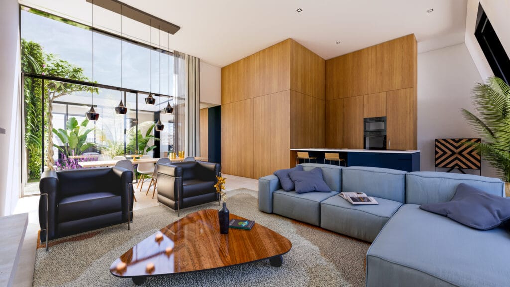 Interieur groene patio in penthouse vanuit woonkamer. Houten kastenwand over volledige lengte. Verhoogde woonkamer voor ruimtelijkheid en grotere gevelopeningen naar patio, wat zorgt voor veel licht in woon- en eetkamer. Achter de bank is de keuken met contrasterend schiereiland geplaatst.